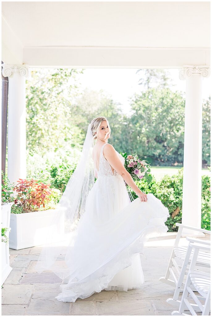 Bride twirls her tulle ballgown wedding dress and floor-length veil

River Farm Wedding | Alexandria Wedding Photographer
