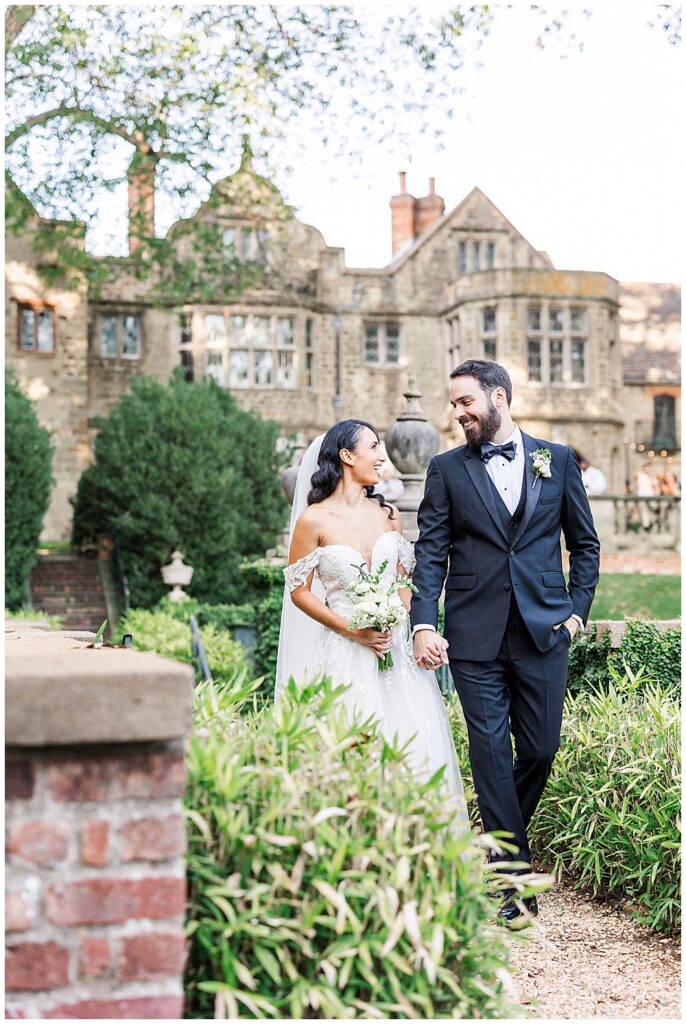 A bride and groom pose for newlywed portraits at Virginia House in Richmond, serving as their enchanting, fairytale estate wedding venue. Photos by a Richmond wedding Photographer, Emily Nicole Photography.