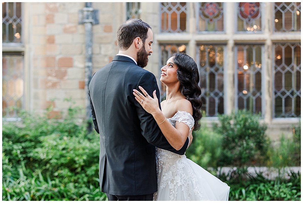 Bride and Groom share an intimate, slow first dance against a beautiful stained window backdrop at their Virginia House wedding in Richmond.