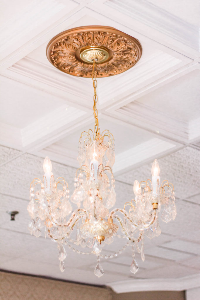 chandelier, gold, white ceiling, ornate, crystal chandelier, lighting, wedding details, wedding decor