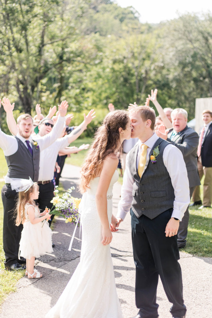 daytime faux exit, faux exit without sparklers, alternative wedding exit ideas, faux exit ideas, bride and groom kiss after their exit
