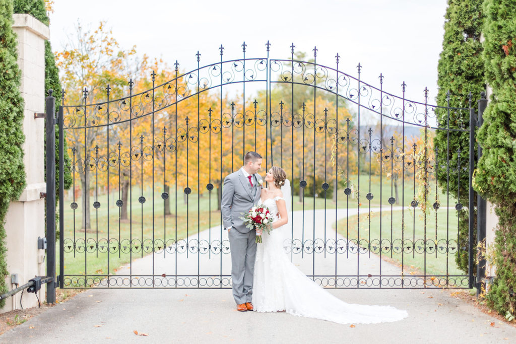 breaux vineyard, entrance, gate, bride and groom portrait