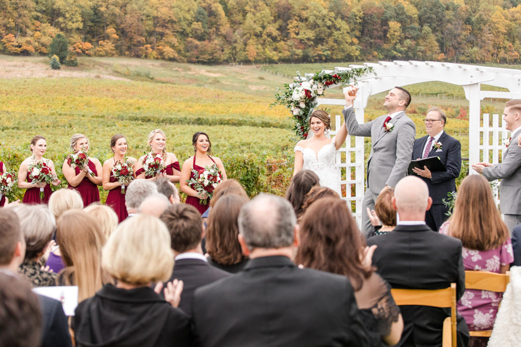 breaux vineyard, bride and groom, recessional, fall wedding, fall florals, burgundy wedding, wine wedding