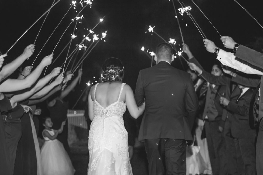 sparkler exit, bride and groom enjoy their controlled exit on the night of their wedding.
