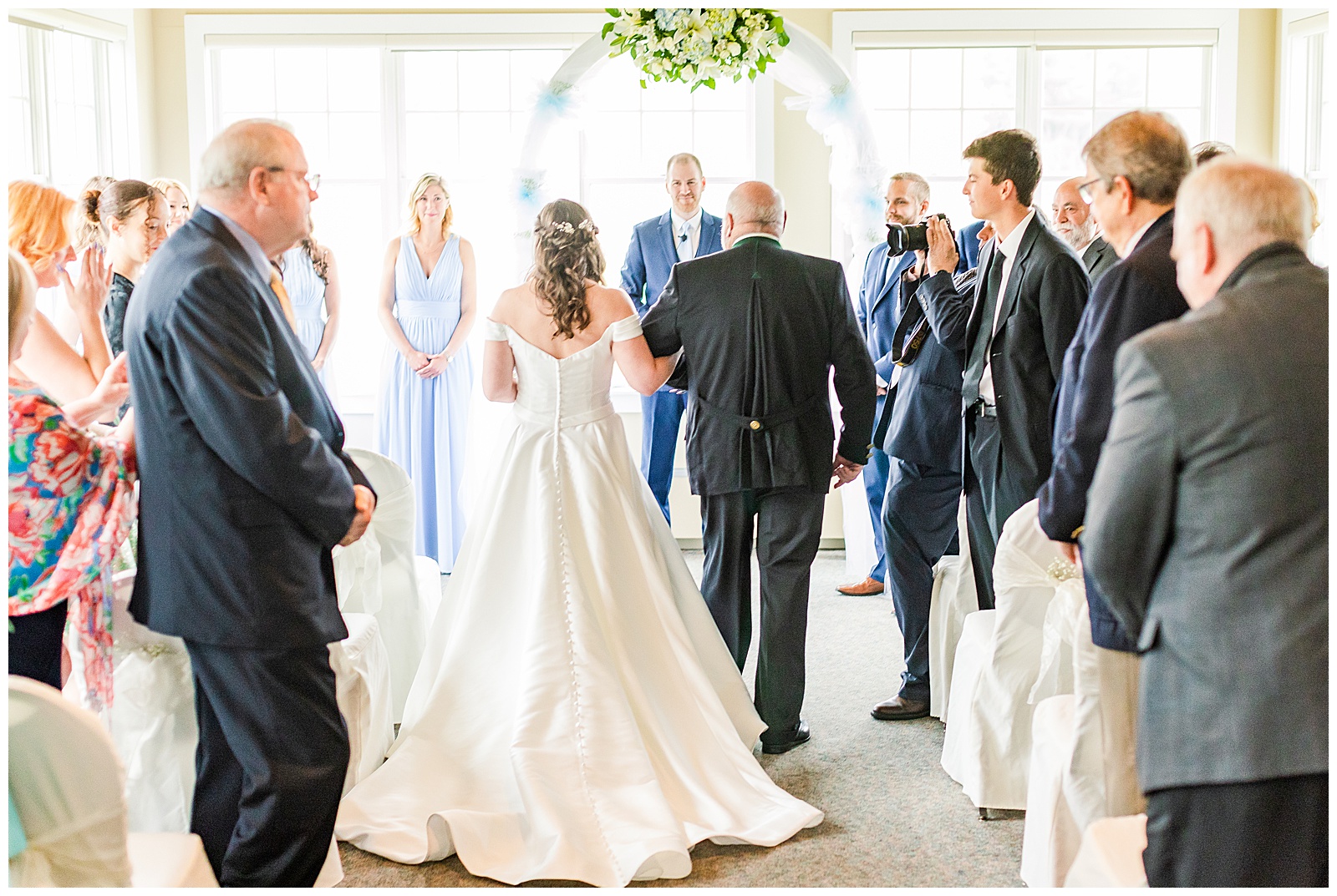what order should the wedding processional be? a bride walking down the aisle with the Father of the Bride during a wedding ceremony.