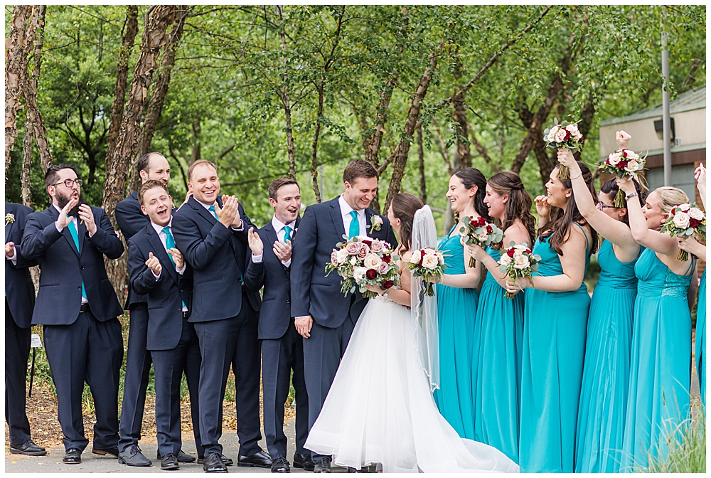Bridal party cheers for the newlyweds at the Royal Sonesta in Baltimore, Maryland