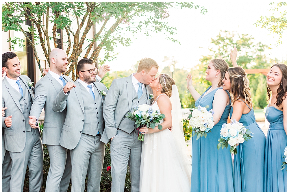 Bridal party portraits with dusty blue bridesmaid dresses and light grey groomsmen suits at 1757 Golf Club wedding by Northern Virginia wedding photographer, Ashburn, VA