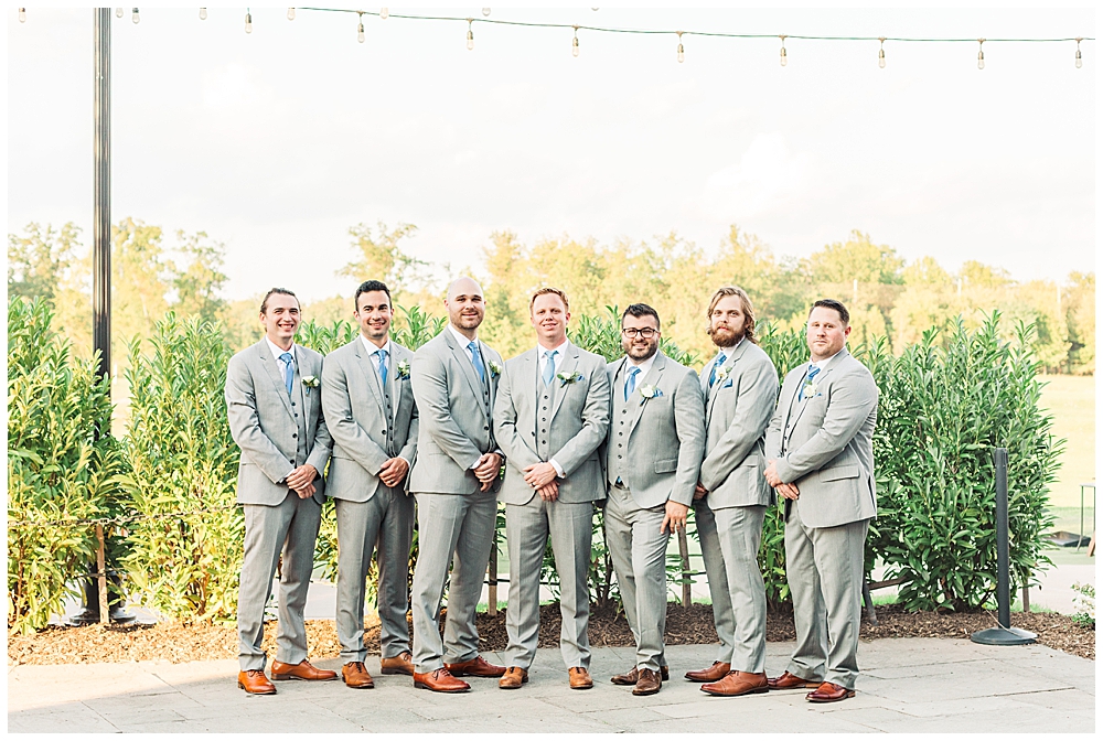 Groomsmen portraits at a wedding on the Outside Terrace at the 1757 Golf Club taken by Northern Virginia wedding photographer