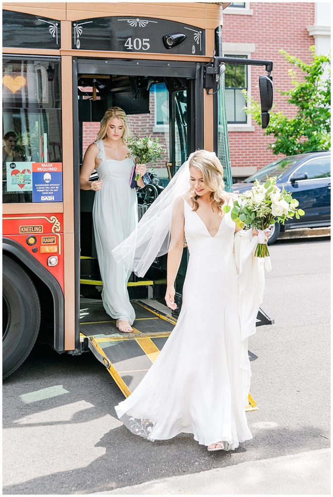 Old Town Alexandria Wedding photographer bride arrives at wedding ceremony in a vintage street car