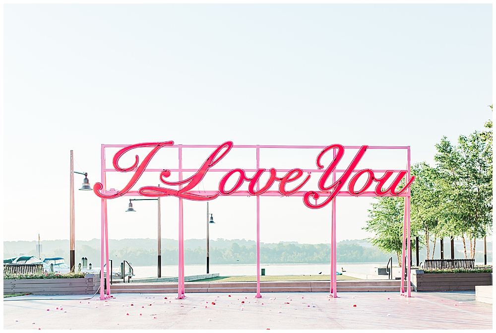 Alexandria waterfront engagement photos in northern Virginia next to I Love You sign at Waterfront Park by a VA wedding photographer