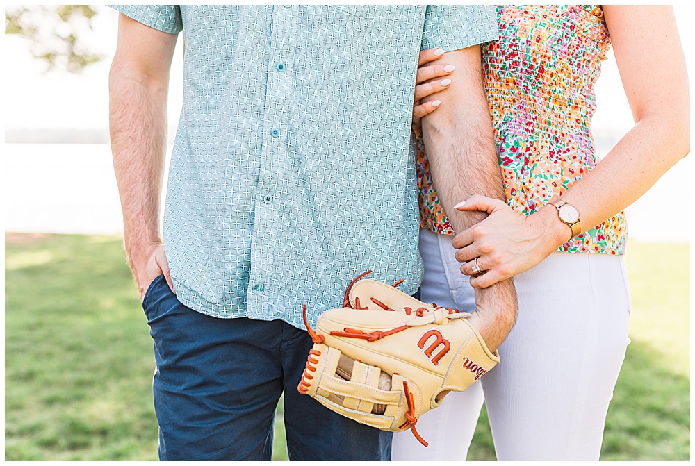couple wears Wilson baseball gloves in baseball themed engagement session
