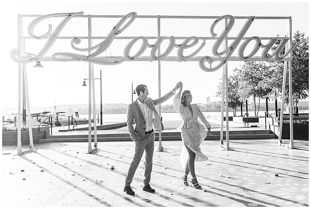Alexandria waterfront engagement session in northern Virginia next to I Love You sign at Waterfront Park by a VA wedding photographer