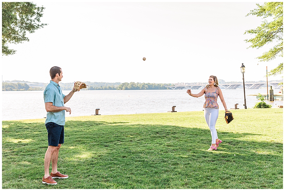 couple plays catch with Wilson baseball gloves in baseball themed engagement session