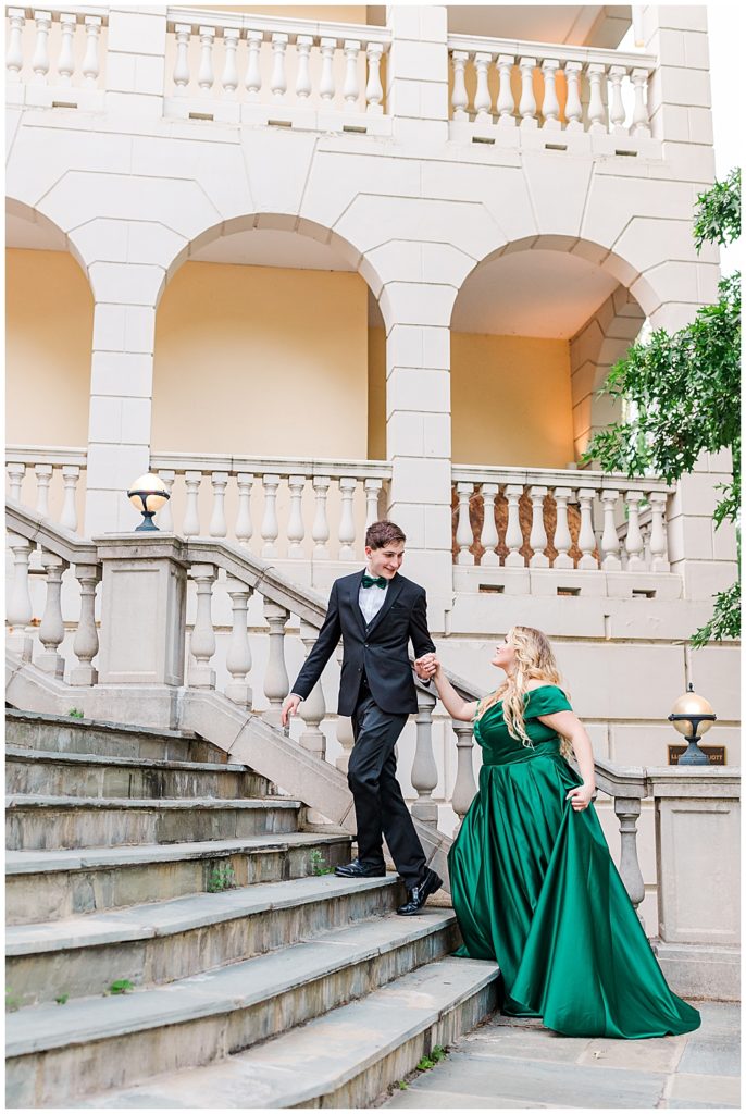 Airlie engagement session on the main steps in a green, satin princess gown.