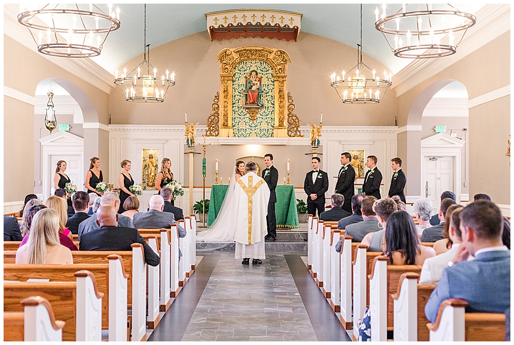 Officiant standing in aisle during wedding ceremony | 2023 wedding trends as predicted by a Virginia wedding photographer