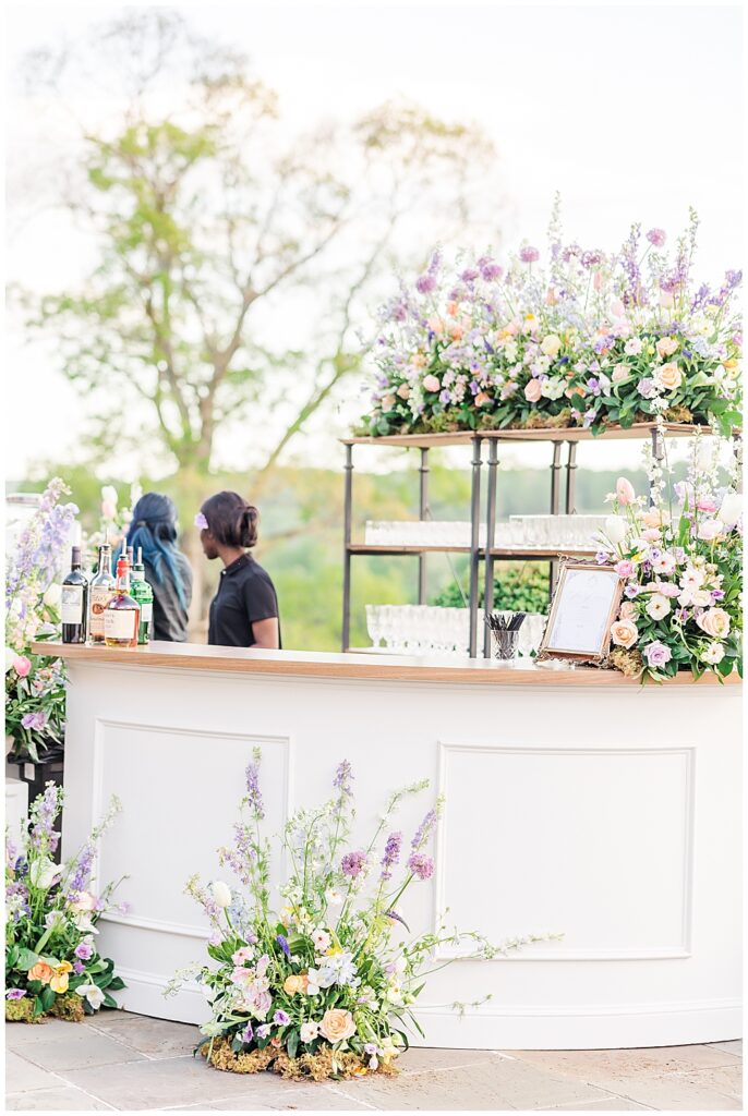 Pastel floral design and bar setup inspo for outdoor Estate at River Run wedding venue | VA wedding photographer