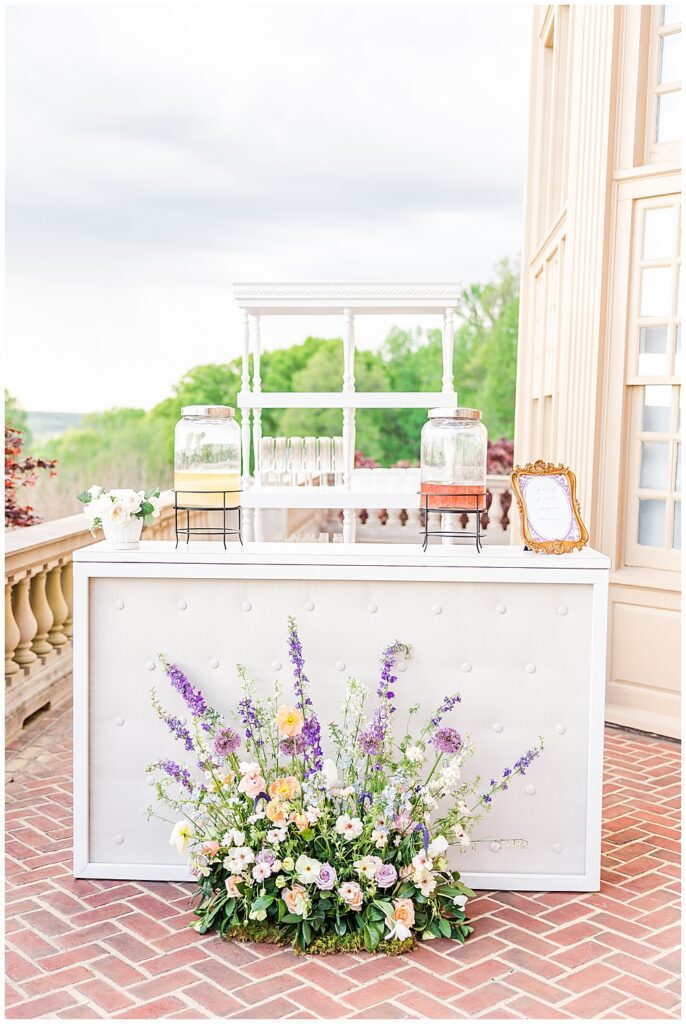 Pastel pinks, lilacs, and blue wedding floral inspiration at wedding beverage station or bar | VA wedding photographer