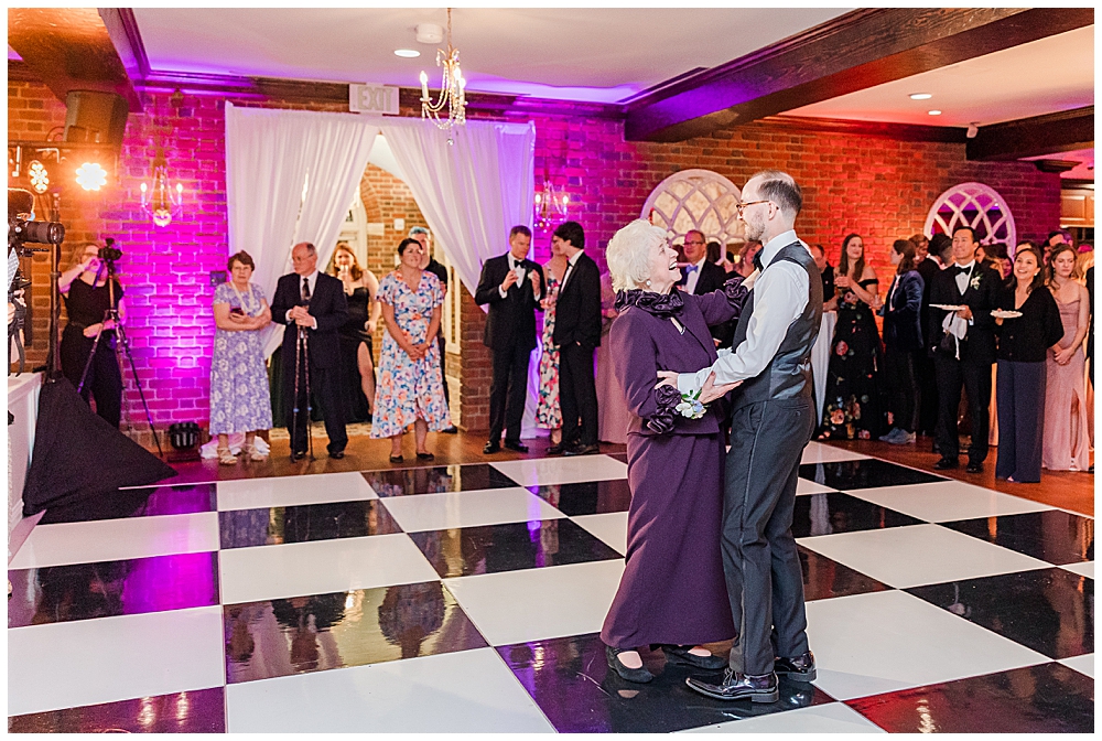 Tuscan ballroom transformed into classy jazz club for wedding reception at Estate at River Run wedding | Groom and Mother of the Groom share Mother-Son Dance | Northern VA Wedding Photographer