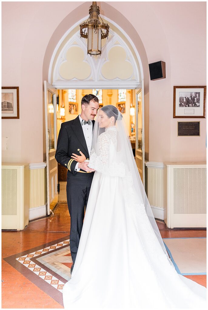 Portrait of a bride and groom at their traditional Catholic wedding at Basilica School of Saint Mary in Washington, D.C. | Photo taken by D.C. wedding photographer