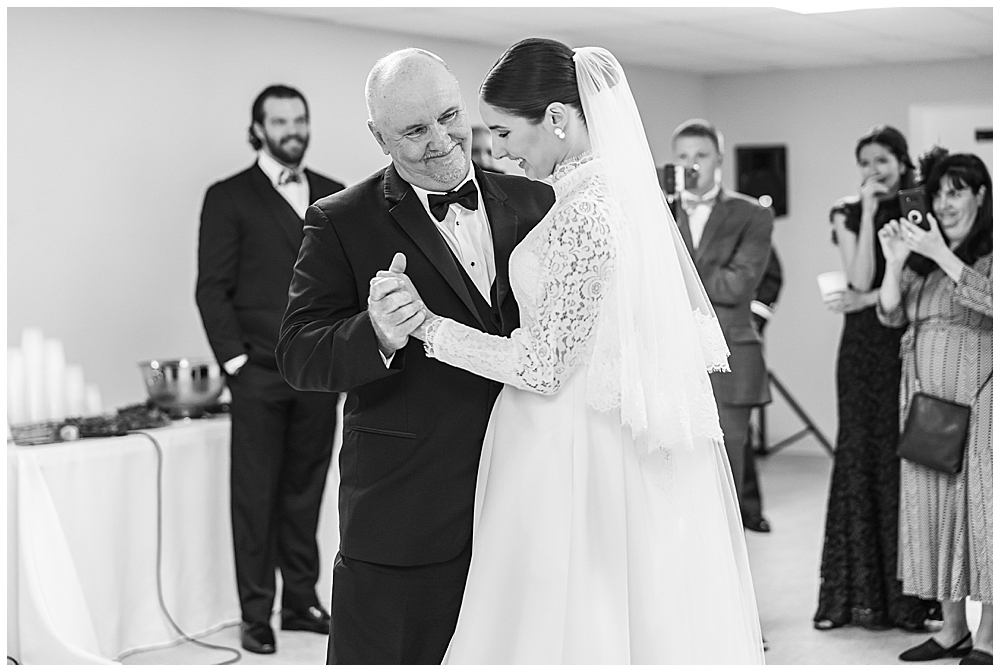 Bride shares a Father-Daughter dance after her traditional Catholic wedding ceremony at Basilica School of Saint Mary in Washington, D.C. | Photo taken by D.C. wedding photographer
