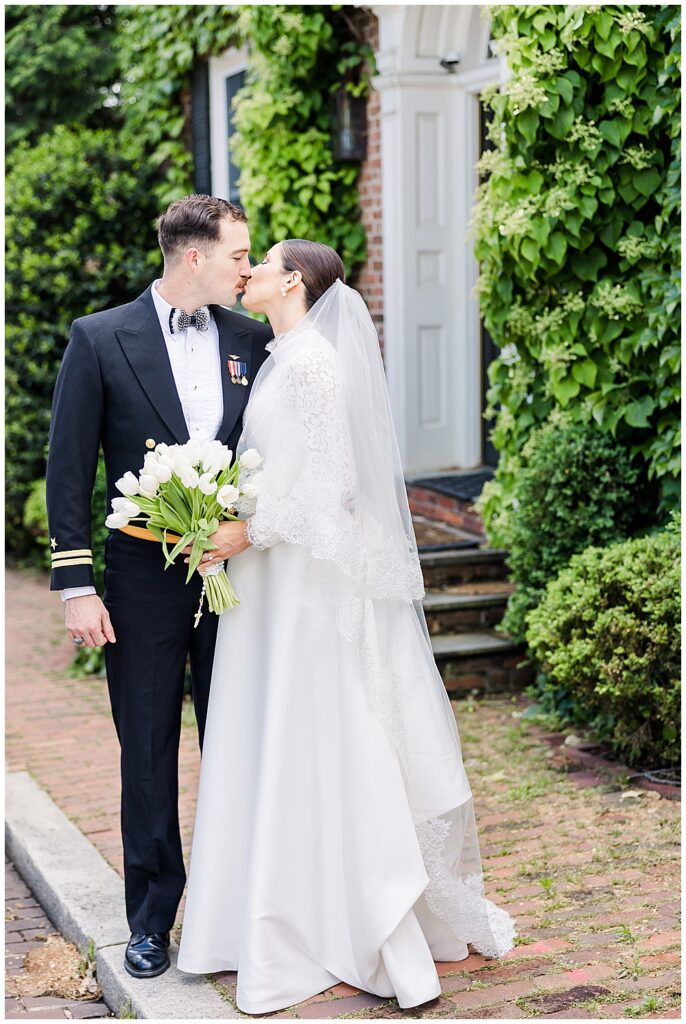 Bride and groom share a kiss in Georgetown in Washington, D.C. | Photo taken by D.C. wedding photographer