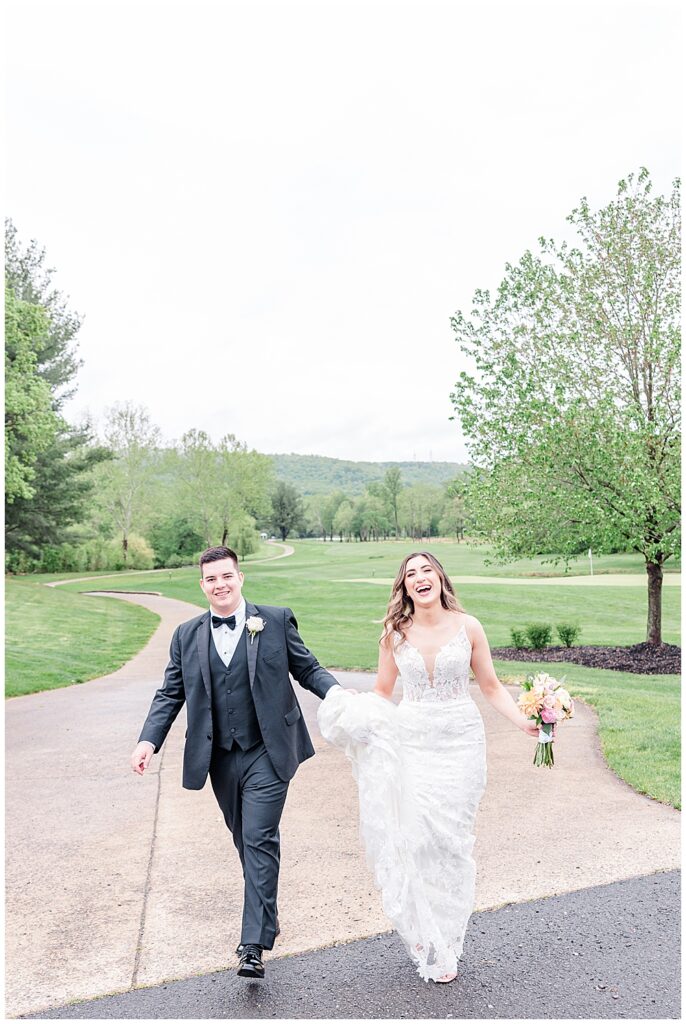 Joyful candid photos of bride and groom at their Evergreen Country Club wedding | Northern VA wedding photographer