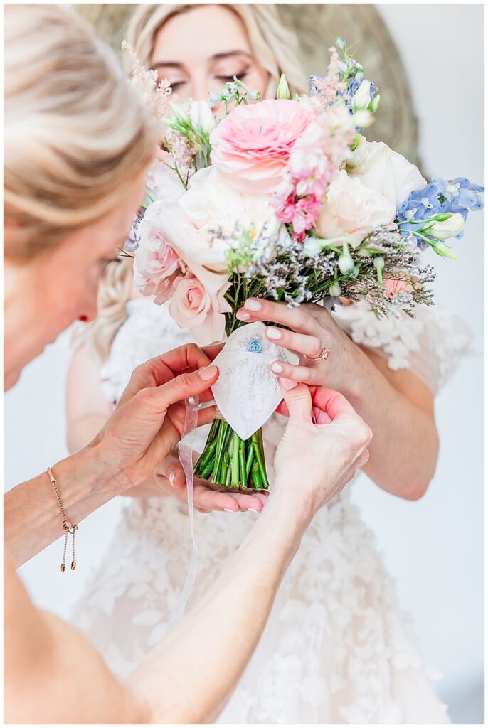 Inspiration for sentimental "Something Blue" on wedding day; a bouquet handkerchief with pocket holding charm photo of grandmother inside | Fairytale-themed Historic Mankin Mansion wedding in June | Richmond wedding photographer
