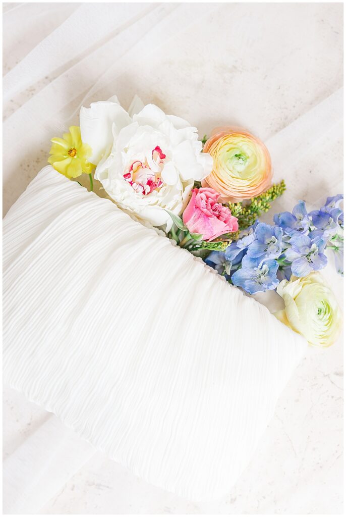 White pleated wedding clutch for bride | The Manor at Airmont wedding | Northern VA Wedding Photographer