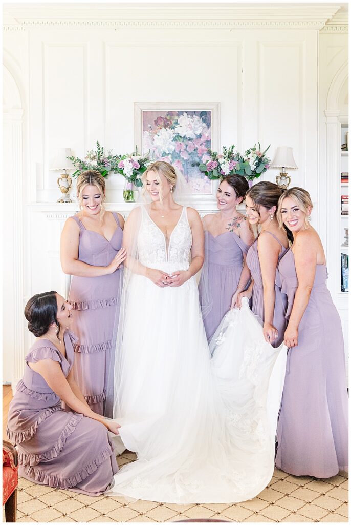Bride surrounded by her 5 bridesmaids, dressed in lavender bridesmaid dresses from Revelry

River Farm Wedding | Alexandria Wedding Photographer