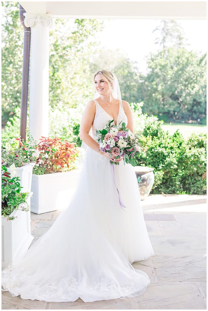 Bride standing in her tulle ballgown wedding dress and floor-length veil

River Farm Wedding | Alexandria Wedding Photographer