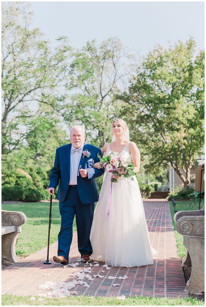 Bride escorted down the aisle by her father during sunny outdoor wedding ceremony

River Farm Wedding | Alexandria Wedding Photographer