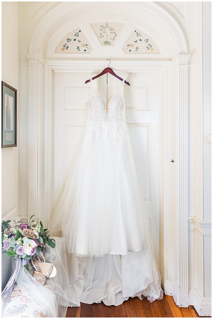 A sleeveless, beaded, ballgown wedding dress with a plunging neckline

River Farm Wedding | Alexandria Wedding Photographer