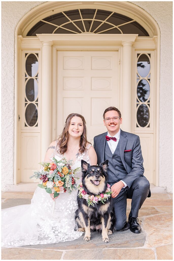 A bride and groom crouch for a picture with their collie-mix dog, wearing a floral collar.

Rust Manor House Wedding | Leesburg Wedding Photography | VA Wedding Venues