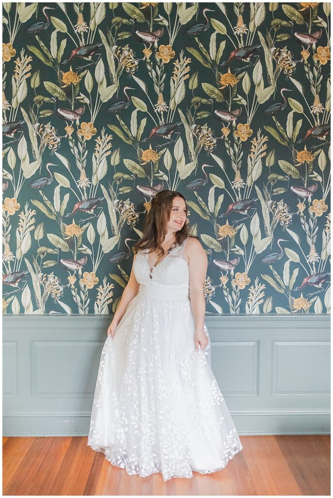 A full-length portrait of a bride in her wedding dress with natural bridal makeup, her hair pinned half-up and loose curls cascading down her shoulders.

Rust Manor House Wedding | Leesburg Wedding Photography | VA Wedding Venues